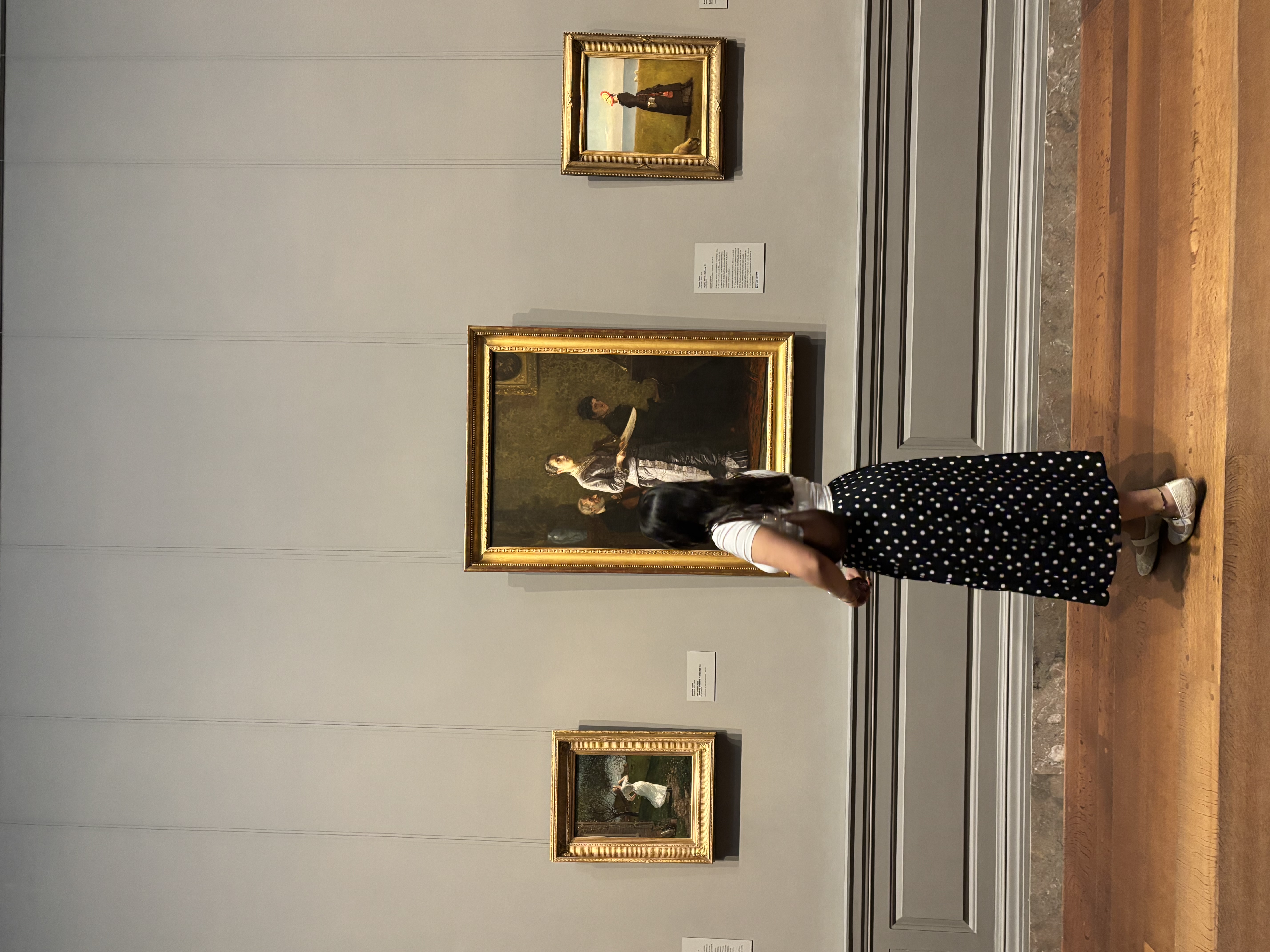 At an art museum, in front of a portrait